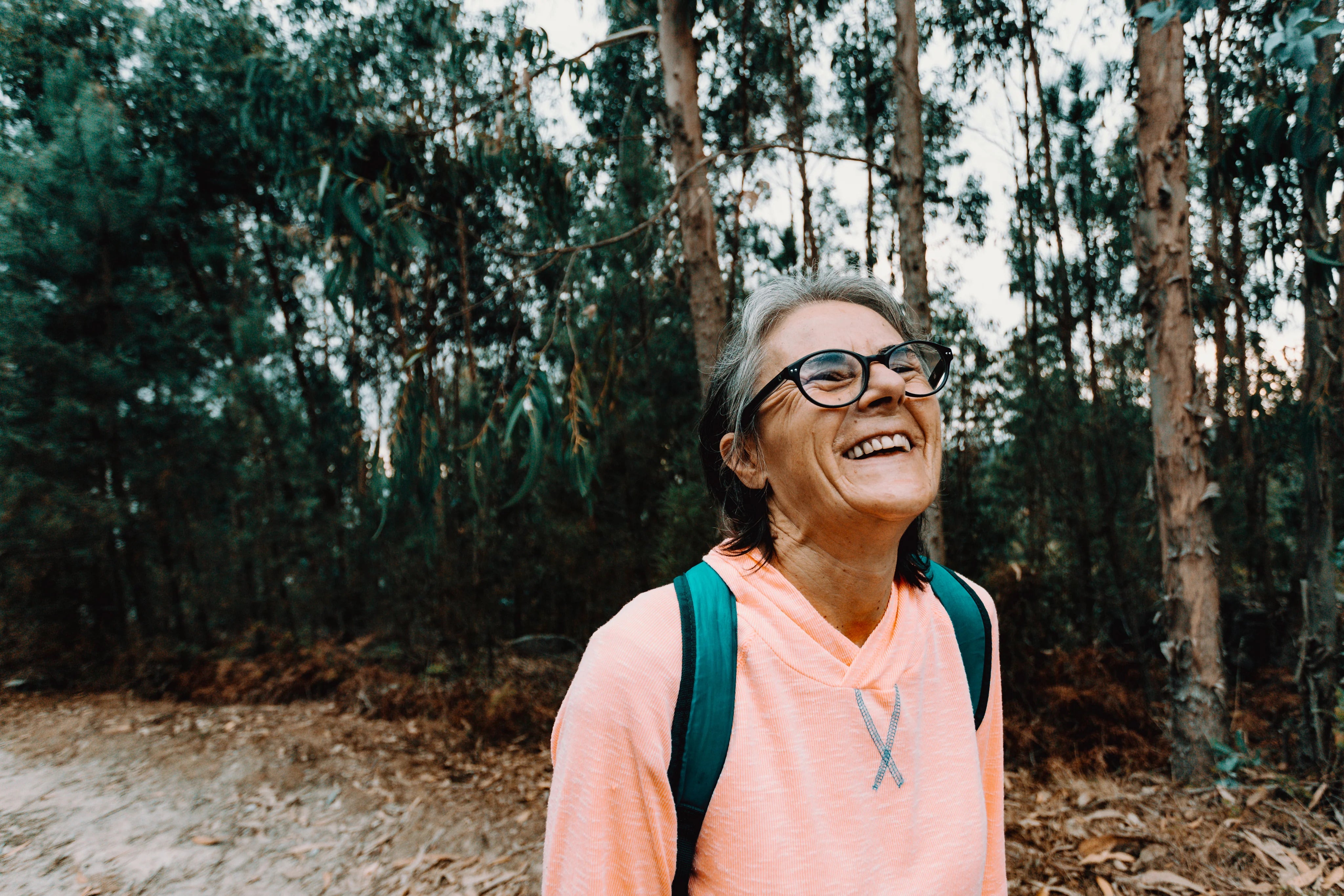 files/imgi_40_woman-tilts-her-head-back-and-smiles-outdoors.jpg